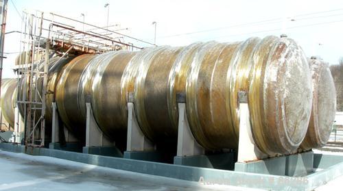 USED: Wallace Murray tank, 34,000 gallon, fiberglass, horizontal. Approx 144" diameter x 40' long. Dished ends. End bottom outlet. Mounted on carbon steel saddles.