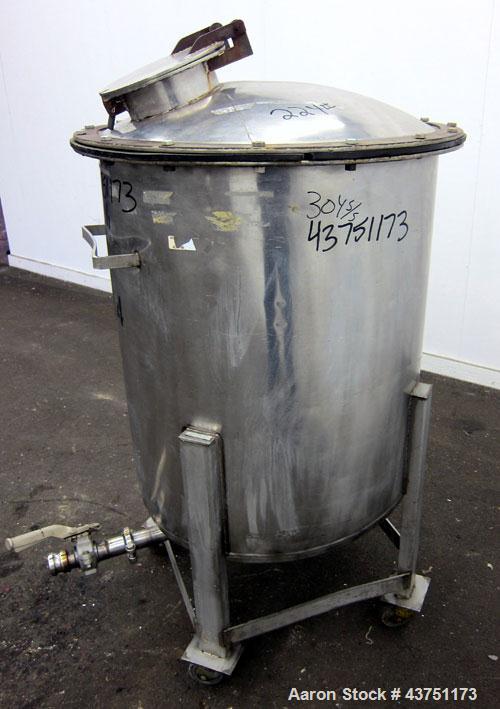 Used Tank, 100 Gallon, 304 Stainless Steel, Vertical.  30" Diameter x 34" straight side.  Dished bolt-on top with an 8" hand hole with cover, 2" sloped bottom.  2" Tri-clamp off center bottom outlet....