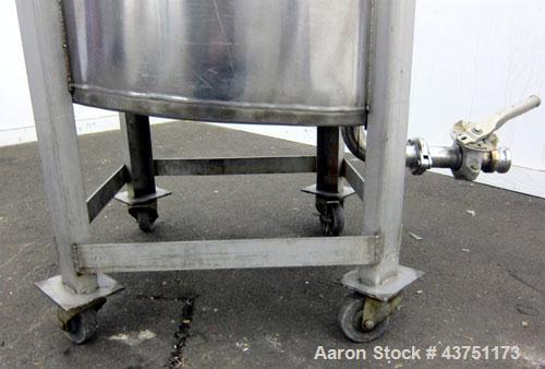 Used Tank, 100 Gallon, 304 Stainless Steel, Vertical.  30" Diameter x 34" straight side.  Dished bolt-on top with an 8" hand hole with cover, 2" sloped bottom.  2" Tri-clamp off center bottom outlet....