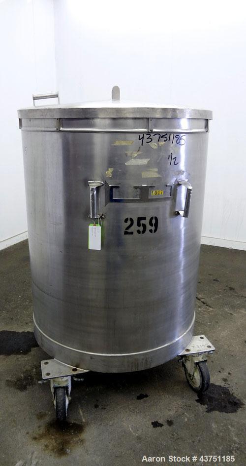 Used Tank, 200 Gallon, 304 Stainless Steel, Vertical.  Approximately 38" diameter x 47" straight side.  Open top with a 1 piece cover, 1/2" sloped bottom. 2-1/4" Side bottom outlet.  Skirt mounted wi...