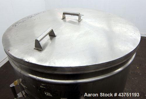 Used Tank, 200 Gallon, 304 Stainless Steel, Vertical. Approximate 38" diameter x 47" straight side. Open top with a 1 piece cover, 1/2" sloped bottom. 2-1/4" Side bottom outlet. Skirt mounted with ca...