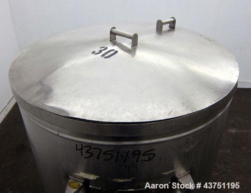 Used Tank, 200 Gallon, 304 Stainless Steel, Vertical.  Approximately 38" diameter x 47" straight side.  Open top with a 1 piece cover, 1/2" sloped bottom. 2-1/4" Side bottom outlet.  Skirt mounted wi...