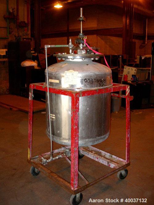 Used Used: Buckley Iron Works pressure tank, 100 gallon, stainless steel, vertical. 30" diameter x 30" straight side, dished top and bottom. Internal rated 50 psi at 300 degf.. 12" top manway with co...