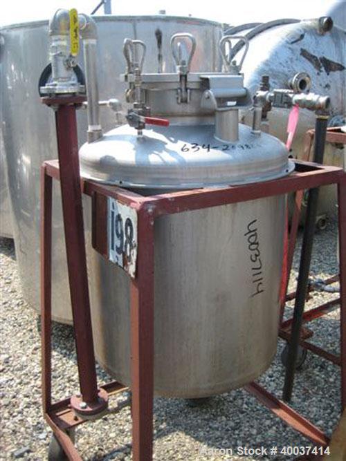 Used O.G. Kelley Co. Pressure Tank, 55 gallon, stainless steel, vertical. 24" diameter x 27" straight side, dished top and bottom. Internal rated 50 psi at 300 deg.f.. Openings top 10" with cover, 2 ...