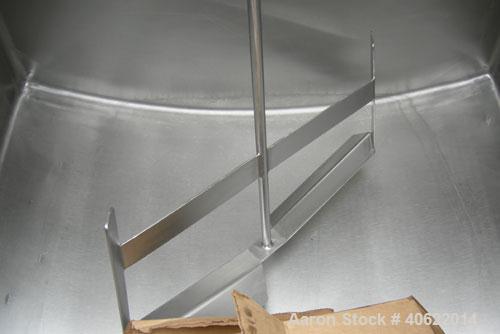 Used Flavor tank, (2) compartment, approximate 250 gallon each, 304 stainless steel.  41" long x 41" wide x approx 34" deep.  U shaped top and bottom.  3/4" diameter shaft with 2 blade bottom sweep a...