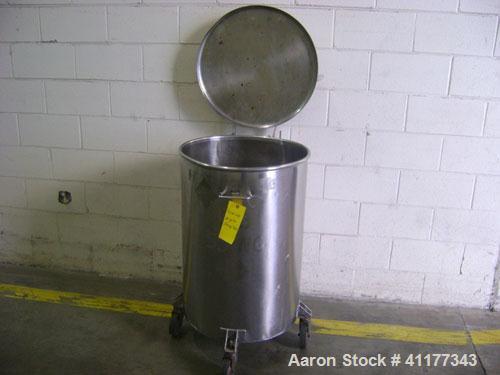 Used- Tank, 60 Gallon, Stainless Steel, Vertical. 22-1/2" diameter x 33" straight side. Open top with hinged cover, flat bot...
