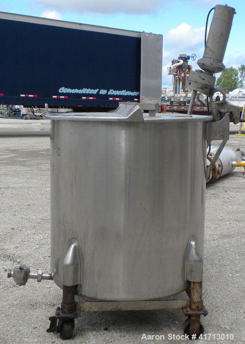 Used Tank, Approximate 140 Gallon, 316 Stainless Steel, Vertical.  34" diameter  x 36" straight side, flat top with hinged cover, sloped bottom.  Includes a clamp on agitator with a 1" diameter shaft...