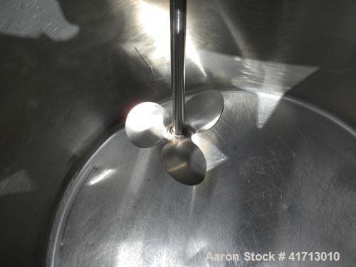 Used Tank, Approximate 140 Gallon, 316 Stainless Steel, Vertical.  34" diameter  x 36" straight side, flat top with hinged cover, sloped bottom.  Includes a clamp on agitator with a 1" diameter shaft...