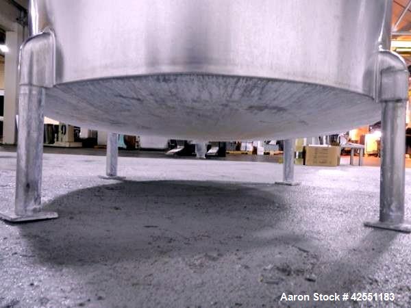 Used Bush Tank, 425 gallon, stainless steel construction, approximately 52" diameter x 48" straight side, open top with cover, flat slopping bottom, 2" bottom outlet, clamp on .5 hp, 230/460 volt Che...