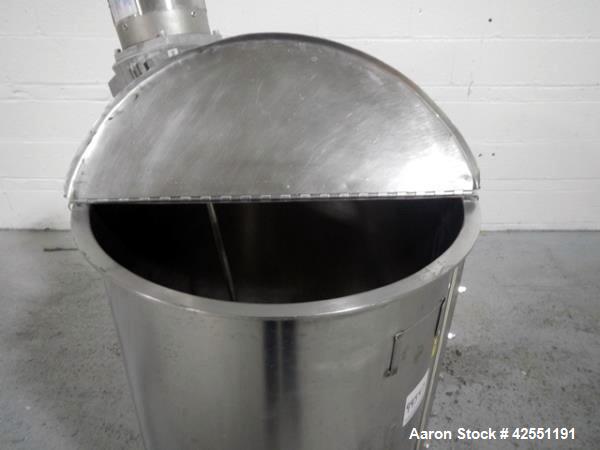 Used Bush Tank, 60 gallon, stainless steel construction, approximately 24" diameter x 32" straight side, open top with hinged cover, flat slopping bottom, 1" bottom outlet, clamp on .5 hp, 230/460 vo...