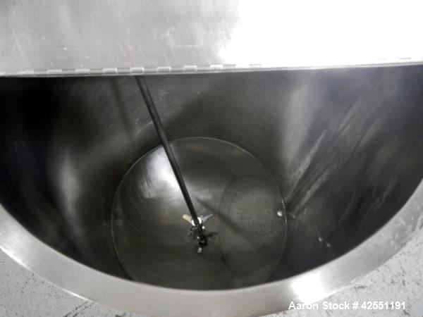 Used Bush Tank, 60 gallon, stainless steel construction, approximately 24" diameter x 32" straight side, open top with hinged cover, flat slopping bottom, 1" bottom outlet, clamp on .5 hp, 230/460 vo...
