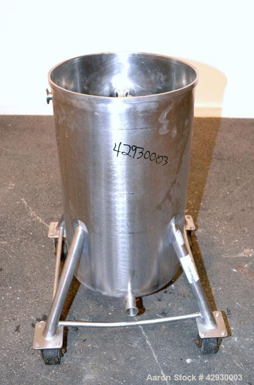 Used Tank, 30 Gallon, 316 Stainless Steel, Vertical. 17-1/2" Diameter x 30" straight side. Open top, no cover, sloped bottom. 1-1/2" Center bottom outlet. Mounted on 4 stainless steel legs with caste...