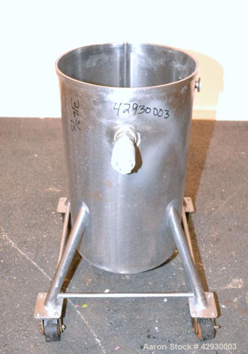 Used Tank, 30 Gallon, 316 Stainless Steel, Vertical. 17-1/2" Diameter x 30" straight side. Open top, no cover, sloped bottom. 1-1/2" Center bottom outlet. Mounted on 4 stainless steel legs with caste...