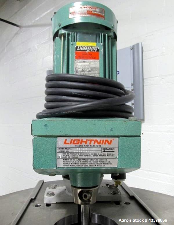 Used Tank, 100 Gallon, Stainless Steel. Approximately 30" diameter x 36" straight side, flat top, dished bottom, top entering 1.74 hp Lightnin agitator, model XD-174, with (3) tier (3) blade agitator...
