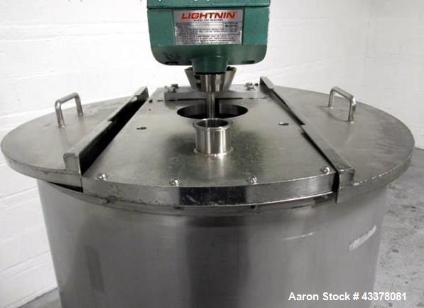 Used Tank, 100 Gallon, Stainless Steel. Approximately 30" diameter x 36" straight side, flat top, dished bottom, top entering 1.74 hp Lightnin agitator, model XD-174, with (3) tier (3) blade agitator...