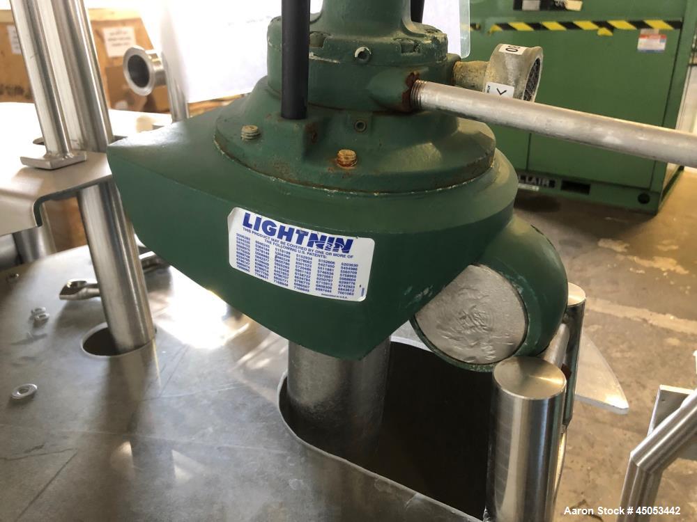 Used Permasan 44 Gallon SIngle Wall Stainless Steel Tank with Lightnin Mixer Modes XDA33. Mounted on casters with bottom valve.