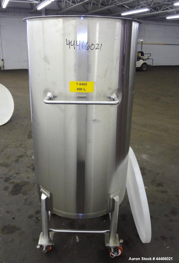 Used Tank, 106 Gallon (400 Liter), 316 Stainless Steel, Vertical. Approximate 27-1/2" diameter x 47-1/2" straight side, open top, no cover, coned bottom. 1" Center bottom outlet. Mounted on 4 stainle...