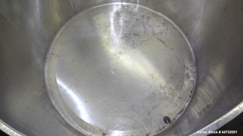 Used Tank, 125 Gallon, 304 Stainless Steel, Vertical. Approximately 38" diameter x 27" straight side. Flat open top with a 1 piece cover, sloped bottom. 1-1/2" Tri-clamp off center bottom outlet. Mou...