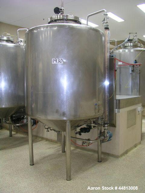 Used Stainless Steel Tank, 1500 liter capacity, 1200 mm diameter x 1350 mm high, jacketed, conical top with center bolted manway, conical bottom with 2' center discharge, fully welded insulation.  Ve...