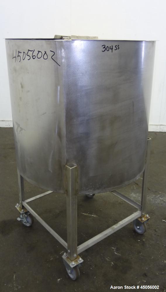 Used Tank, 80 Gallon, 304 Stainless Steel, Vertical. Approximately 30-1/2" diameter x 27" straight side, open top with (2) half hinged covers, provision for a clamp on agitator. 2" Side bottom outlet...