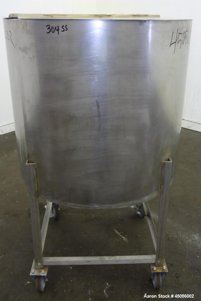 Used Tank, 80 Gallon, 304 Stainless Steel, Vertical. Approximately 30-1/2" diameter x 27" straight side, open top with (2) half hinged covers, provision for a clamp on agitator. 2" Side bottom outlet...