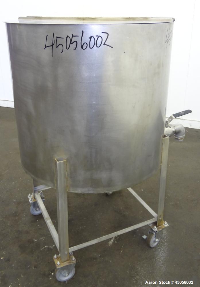 Used Tank, 80 Gallon, 304 Stainless Steel, Vertical. Approximately 30-1/2" diameter x 27" straight side, open top with (2) half hinged covers, provision for a clamp on agitator. 2" Side bottom outlet...