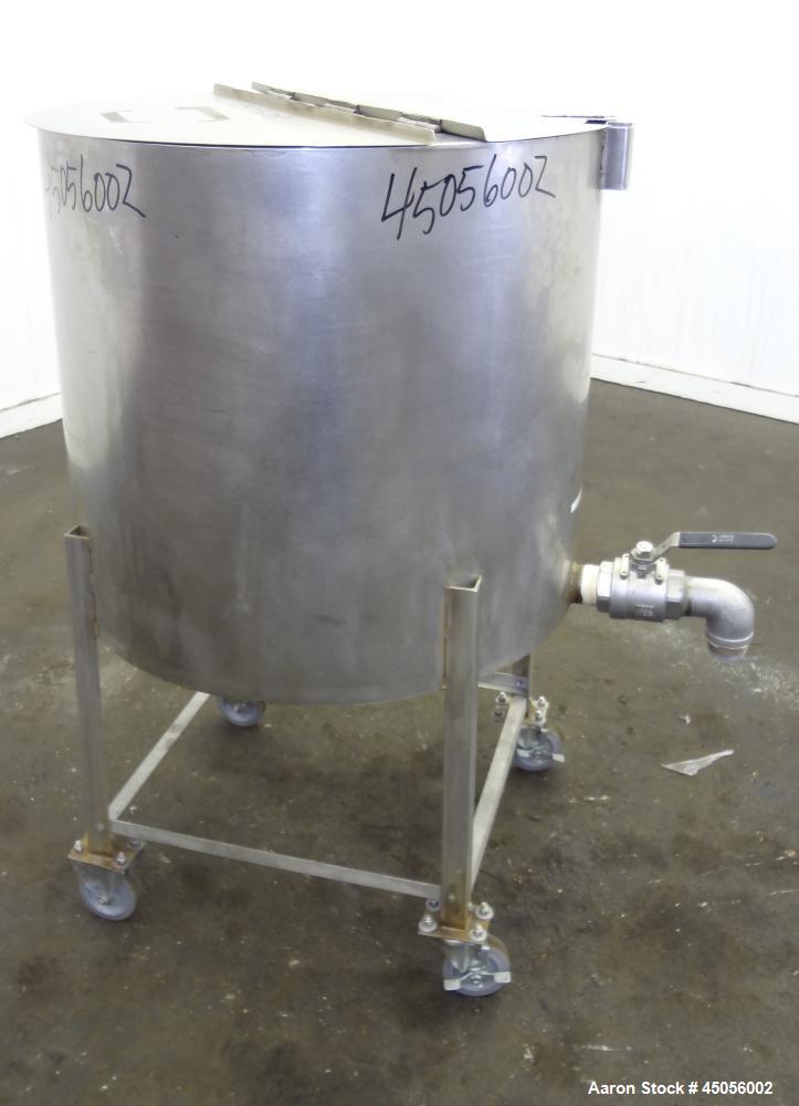 Used Tank, 80 Gallon, 304 Stainless Steel, Vertical. Approximately 30-1/2" diameter x 27" straight side, open top with (2) half hinged covers, provision for a clamp on agitator. 2" Side bottom outlet...