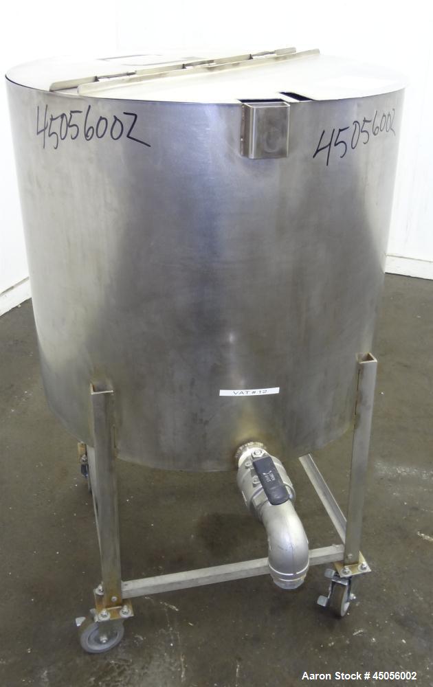 Used Tank, 80 Gallon, 304 Stainless Steel, Vertical. Approximately 30-1/2" diameter x 27" straight side, open top with (2) half hinged covers, provision for a clamp on agitator. 2" Side bottom outlet...