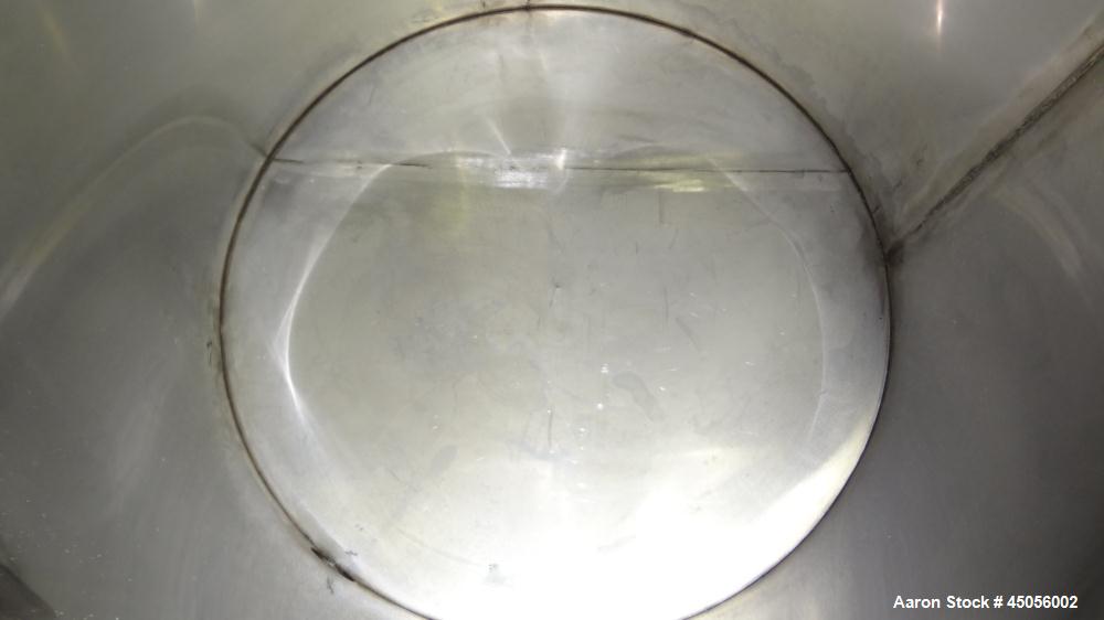Used Tank, 80 Gallon, 304 Stainless Steel, Vertical. Approximately 30-1/2" diameter x 27" straight side, open top with (2) half hinged covers, provision for a clamp on agitator. 2" Side bottom outlet...