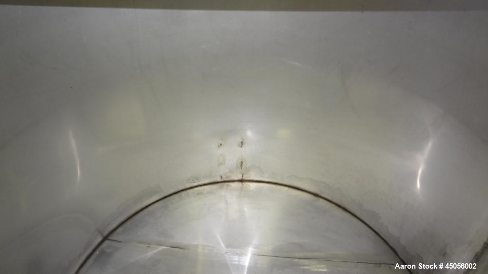Used Tank, 80 Gallon, 304 Stainless Steel, Vertical. Approximately 30-1/2" diameter x 27" straight side, open top with (2) half hinged covers, provision for a clamp on agitator. 2" Side bottom outlet...