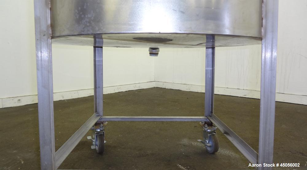 Used Tank, 80 Gallon, 304 Stainless Steel, Vertical. Approximately 30-1/2" diameter x 27" straight side, open top with (2) half hinged covers, provision for a clamp on agitator. 2" Side bottom outlet...