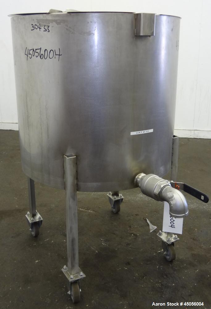 Used Tank, 80 Gallon, 304 Stainless Steel, Vertical. Approximately 30-1/2" diameter x 27" straight side, open top with (2) half hinged covers, provision for a clamp on agitator. 2" Side bottom outlet...