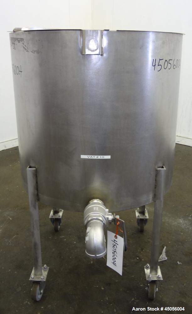 Used Tank, 80 Gallon, 304 Stainless Steel, Vertical. Approximately 30-1/2" diameter x 27" straight side, open top with (2) half hinged covers, provision for a clamp on agitator. 2" Side bottom outlet...