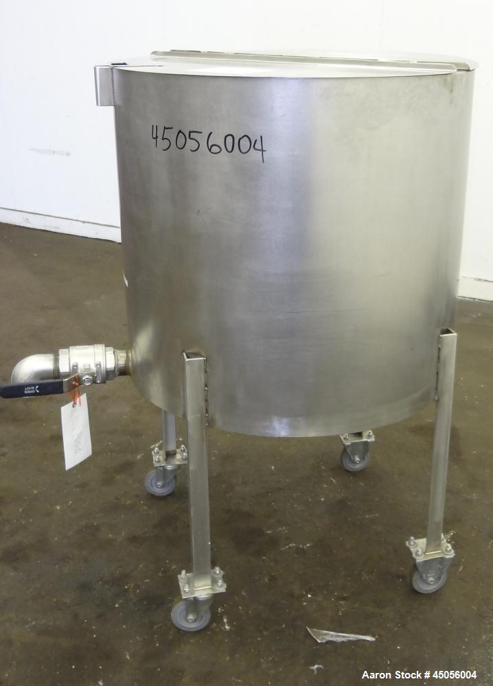 Used Tank, 80 Gallon, 304 Stainless Steel, Vertical. Approximately 30-1/2" diameter x 27" straight side, open top with (2) half hinged covers, provision for a clamp on agitator. 2" Side bottom outlet...