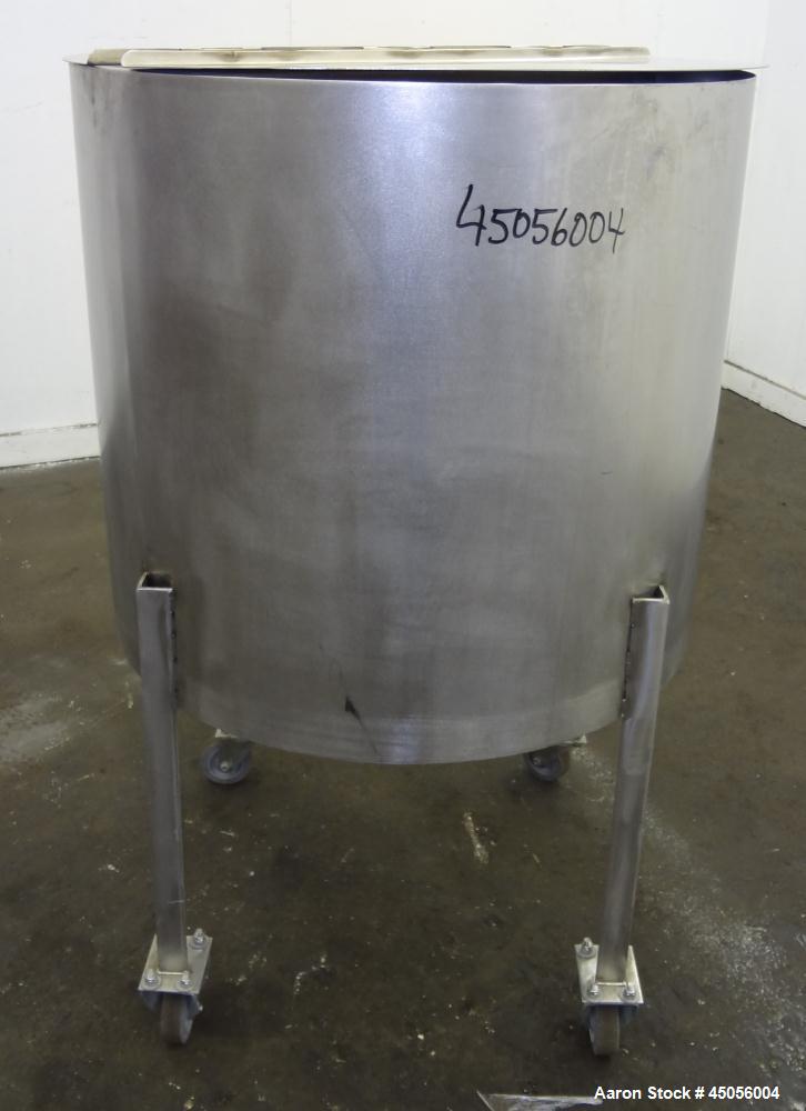 Used Tank, 80 Gallon, 304 Stainless Steel, Vertical. Approximately 30-1/2" diameter x 27" straight side, open top with (2) half hinged covers, provision for a clamp on agitator. 2" Side bottom outlet...