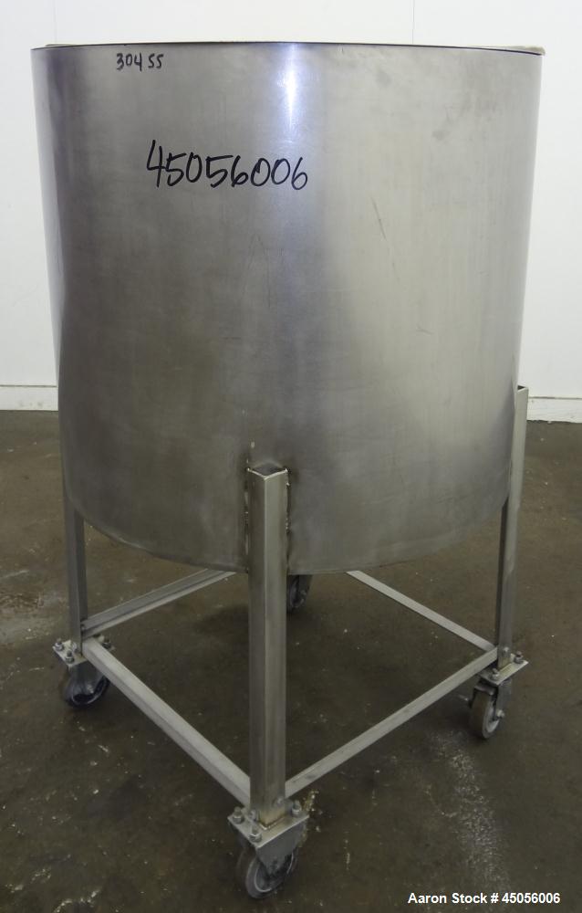 Used Tank, 80 Gallon, 304 Stainless Steel, Vertical. Approximately 30-1/2" diameter x 27" straight side, open top with (2) half hinged covers, provision for a clamp on agitator. 2" Side bottom outlet...