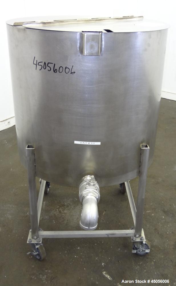 Used Tank, 80 Gallon, 304 Stainless Steel, Vertical. Approximately 30-1/2" diameter x 27" straight side, open top with (2) half hinged covers, provision for a clamp on agitator. 2" Side bottom outlet...