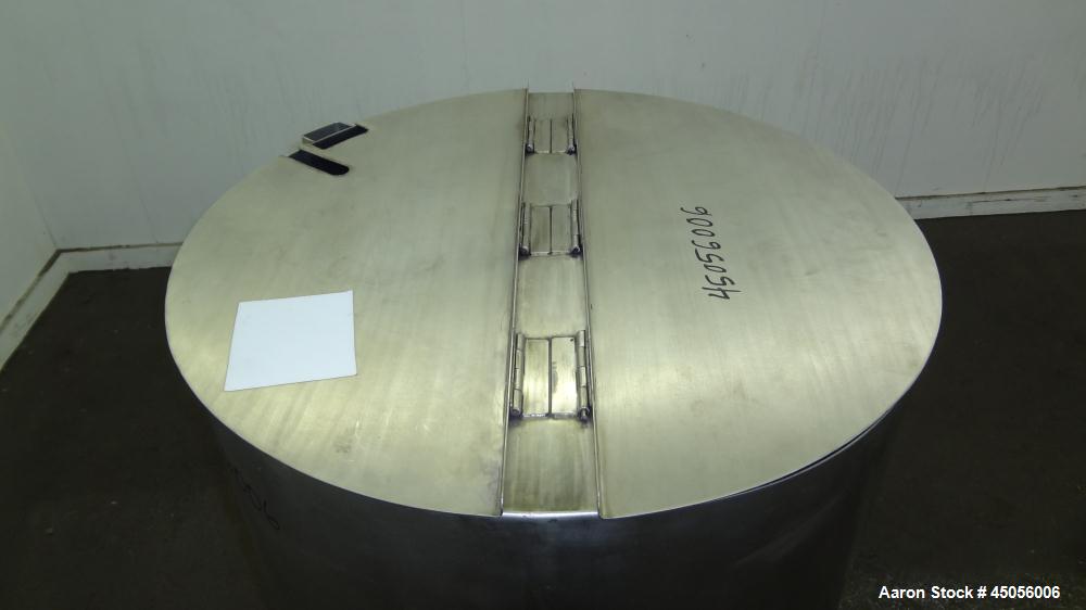 Used Tank, 80 Gallon, 304 Stainless Steel, Vertical. Approximately 30-1/2" diameter x 27" straight side, open top with (2) half hinged covers, provision for a clamp on agitator. 2" Side bottom outlet...