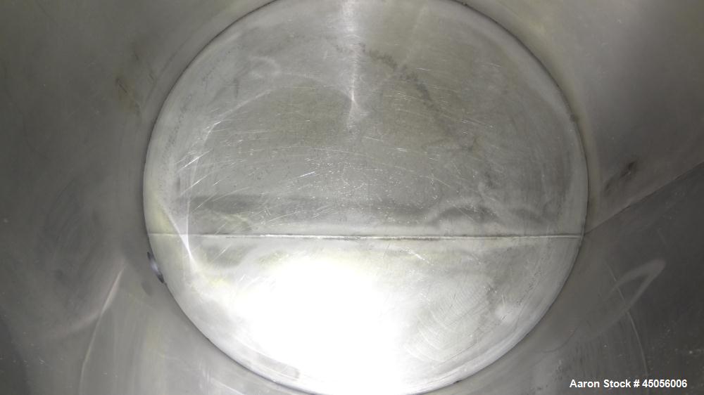 Used Tank, 80 Gallon, 304 Stainless Steel, Vertical. Approximately 30-1/2" diameter x 27" straight side, open top with (2) half hinged covers, provision for a clamp on agitator. 2" Side bottom outlet...