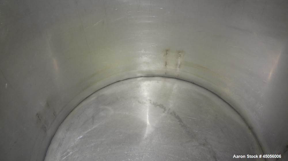 Used Tank, 80 Gallon, 304 Stainless Steel, Vertical. Approximately 30-1/2" diameter x 27" straight side, open top with (2) half hinged covers, provision for a clamp on agitator. 2" Side bottom outlet...