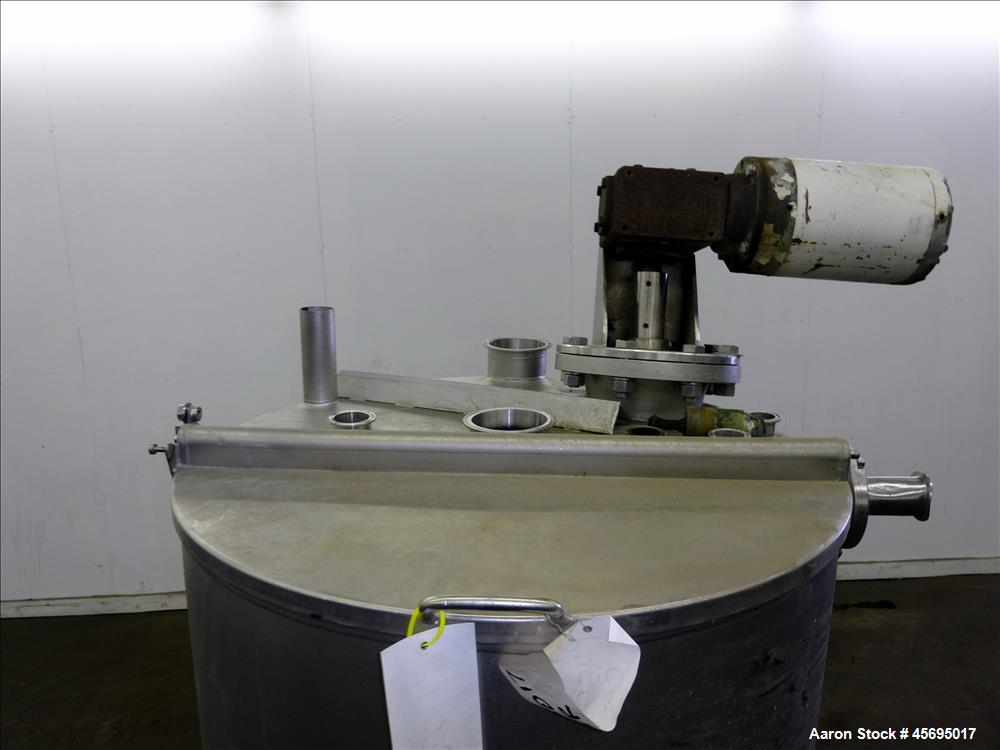 Used Tank, Approximately 150 Gallon, Stainless Steel, Vertical. 31" Diameter x 46" straight side, flat top with a 1/3 hinged cover, sloped bottom. Off center top mounted agitator with a 1-1/4" diamet...
