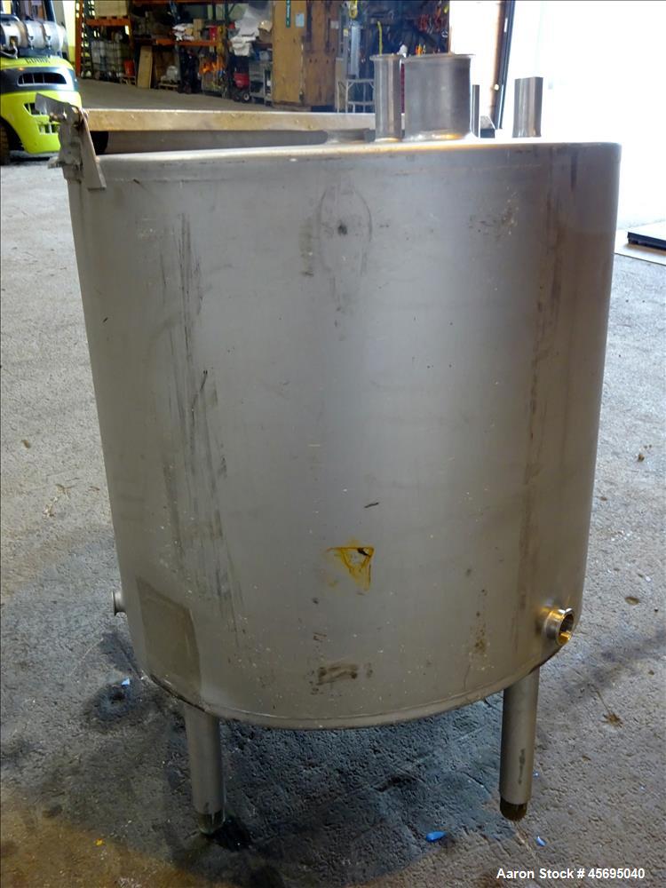 Used Tank, Approximately 140 Gallon, Stainless Steel, Vertical. 36" Diameter x 34" straight side, flat top, 1/3 hinged cover, sloped bottom. Openings top 1-1/2" tri-clamp, (2) 2", 2" tri-clamp, 4" tr...