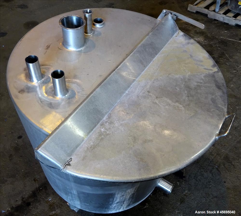 Used Tank, Approximately 140 Gallon, Stainless Steel, Vertical. 36" Diameter x 34" straight side, flat top, 1/3 hinged cover, sloped bottom. Openings top 1-1/2" tri-clamp, (2) 2", 2" tri-clamp, 4" tr...