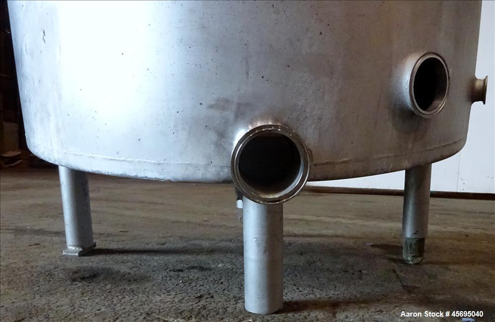 Used Tank, Approximately 140 Gallon, Stainless Steel, Vertical. 36" Diameter x 34" straight side, flat top, 1/3 hinged cover, sloped bottom. Openings top 1-1/2" tri-clamp, (2) 2", 2" tri-clamp, 4" tr...