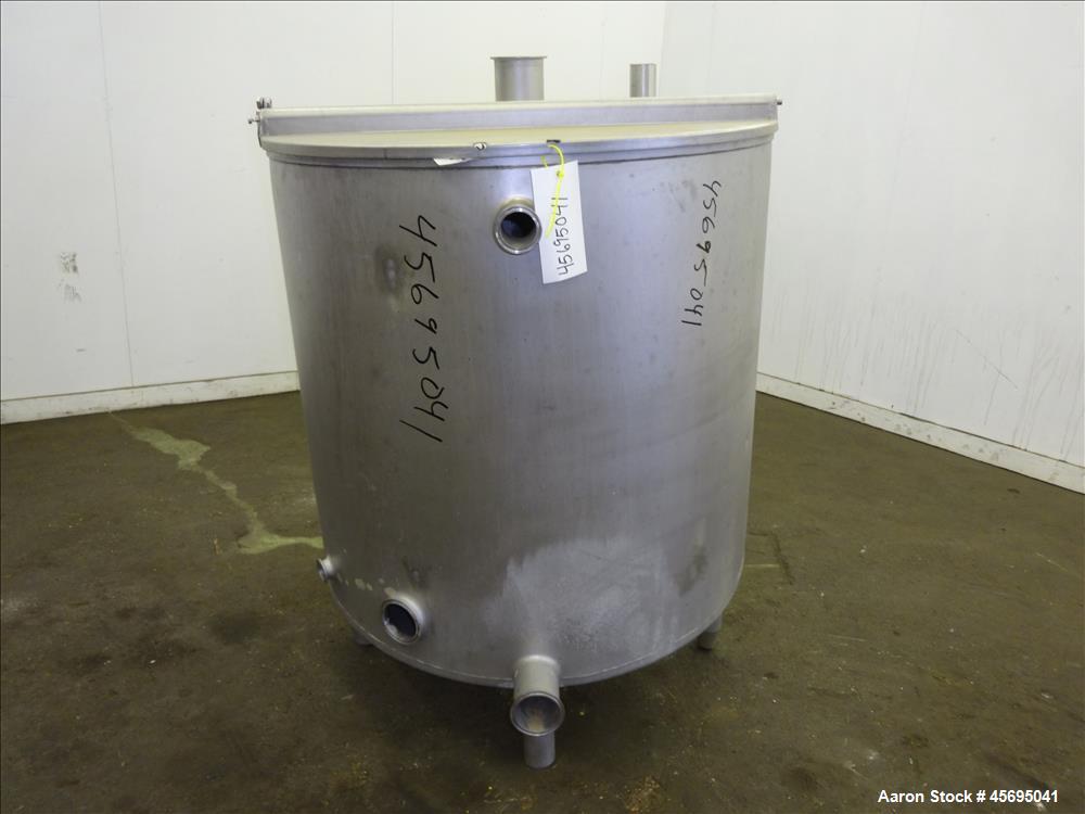 Used Tank, Approximately 140 Gallon, Stainless Steel, Vertical. 36" Diameter x 34" straight side, flat top with a 1/3 hinged cover, sloped bottom. Openings top (2) 2", 2" tri-clamp, 4" tri-clamp. Sid...