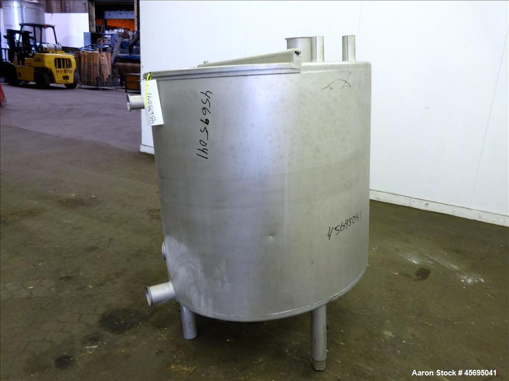 Used Tank, Approximately 140 Gallon, Stainless Steel, Vertical. 36" Diameter x 34" straight side, flat top with a 1/3 hinged cover, sloped bottom. Openings top (2) 2", 2" tri-clamp, 4" tri-clamp. Sid...
