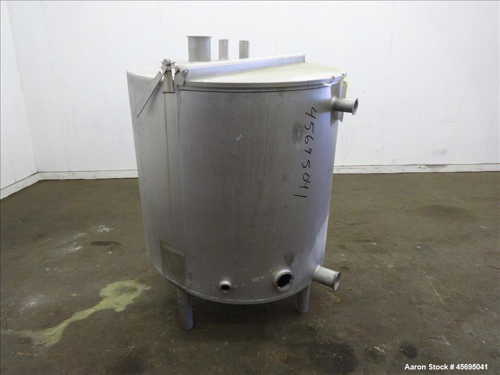 Used Tank, Approximately 140 Gallon, Stainless Steel, Vertical. 36" Diameter x 34" straight side, flat top with a 1/3 hinged cover, sloped bottom. Openings top (2) 2", 2" tri-clamp, 4" tri-clamp. Sid...