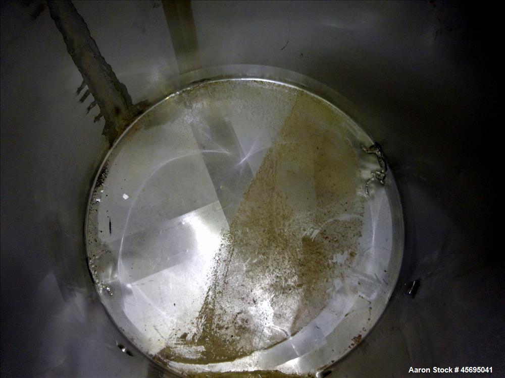 Used Tank, Approximately 140 Gallon, Stainless Steel, Vertical. 36" Diameter x 34" straight side, flat top with a 1/3 hinged cover, sloped bottom. Openings top (2) 2", 2" tri-clamp, 4" tri-clamp. Sid...