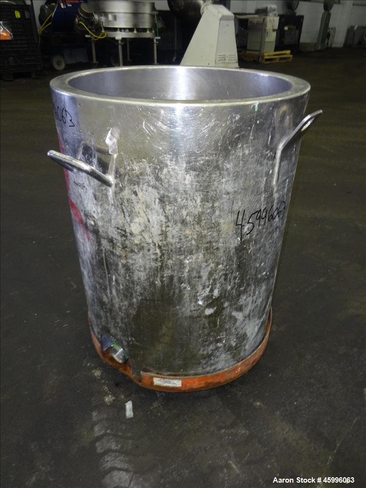 Used Tank, Approximate 30 Gallon, 304 Stainless Steel, Jacketed, Vertical. 20" diameter x 26" straight side. Pitched sloped bottom, open top, with a 2" side bottom outlet. Includes attached heating e...