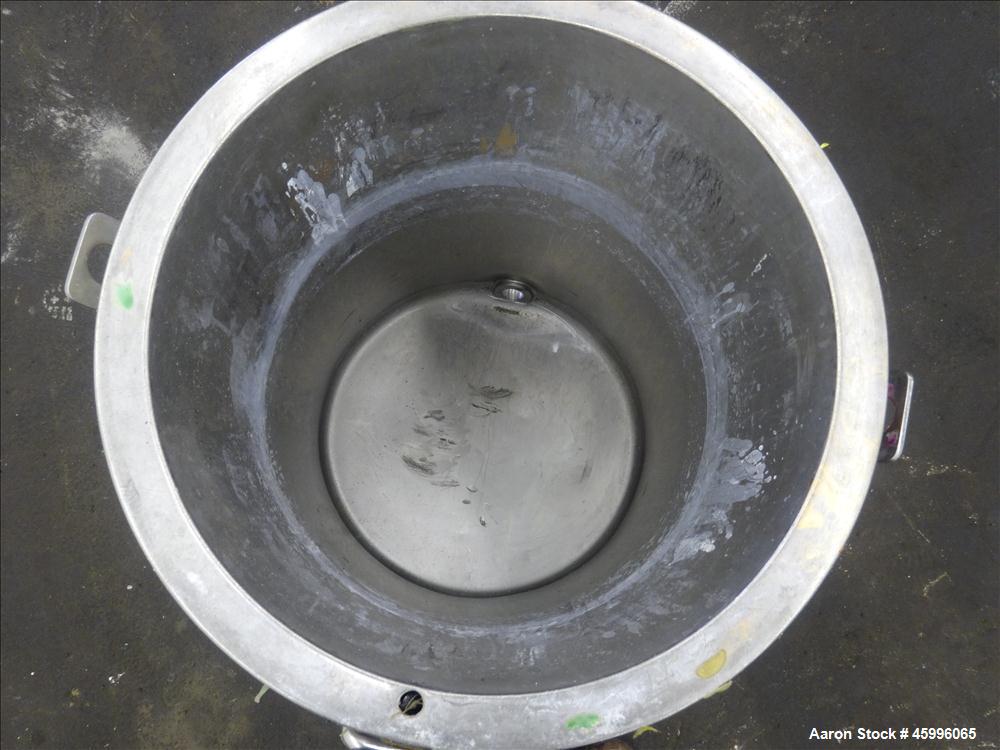 Used Tank, Approximate 30 Gallon, 304 Stainless Steel, Jacketed, Vertical. 20" diameter x 26" straight side. Pitched sloped bottom, open top, with a 2" side bottom outlet. Includes attached heating e...